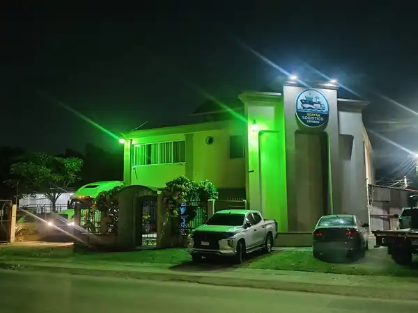 Roatan Logistics Express office lit at night
